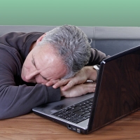 man asleep at computer